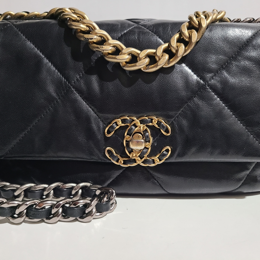 CHANEL Black Quilted Leather Bag with Gold and Silver Chain